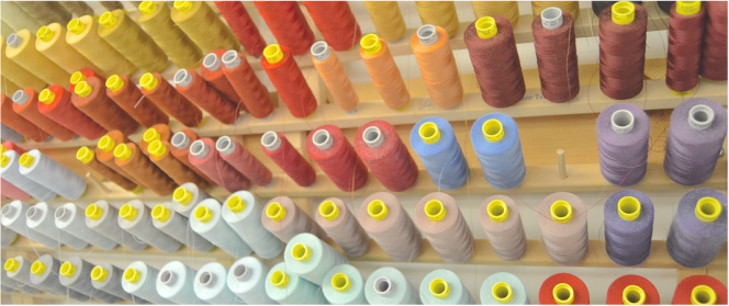 colorful rainbow of thread to illustrate how I source my materials