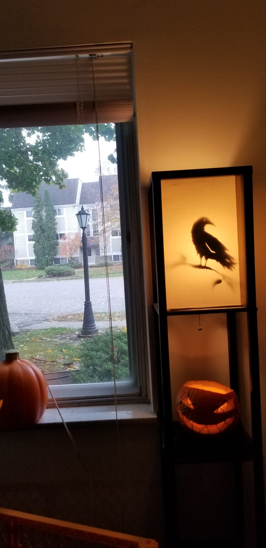 stitched pumpkin and bird silhouette