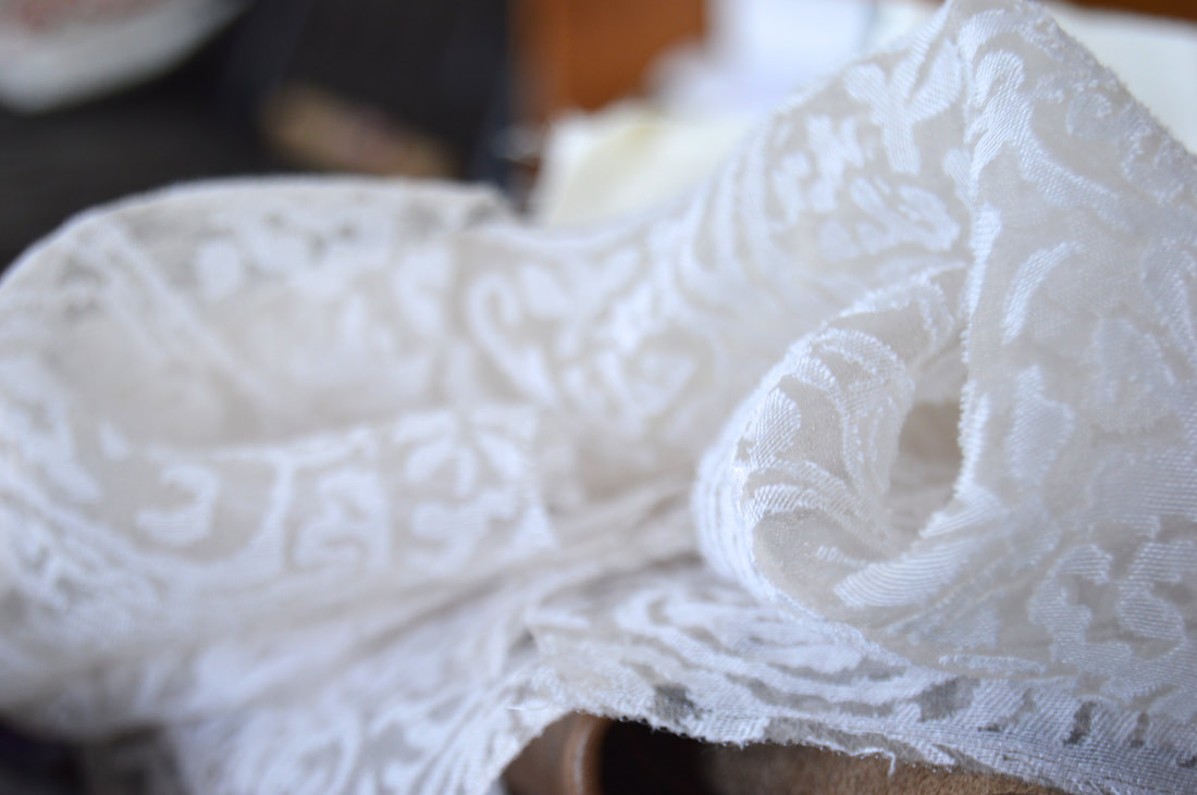 sewing lace onto a robe. The inara blog post