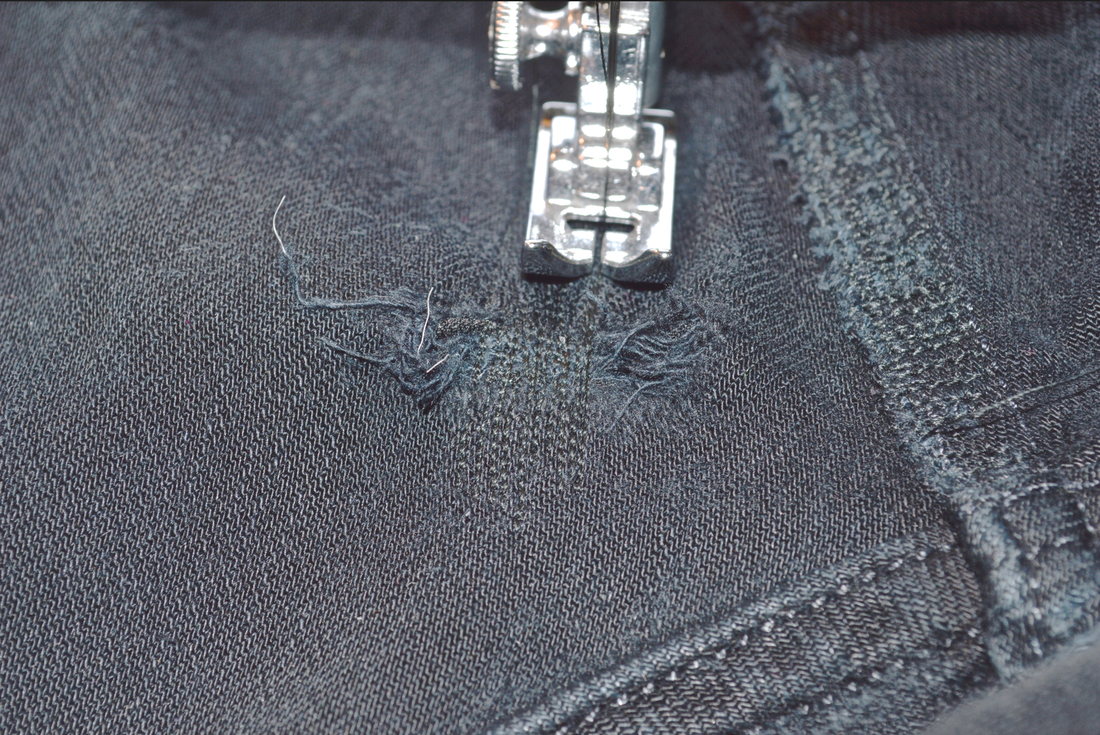 repairing jeans using invisible stitching