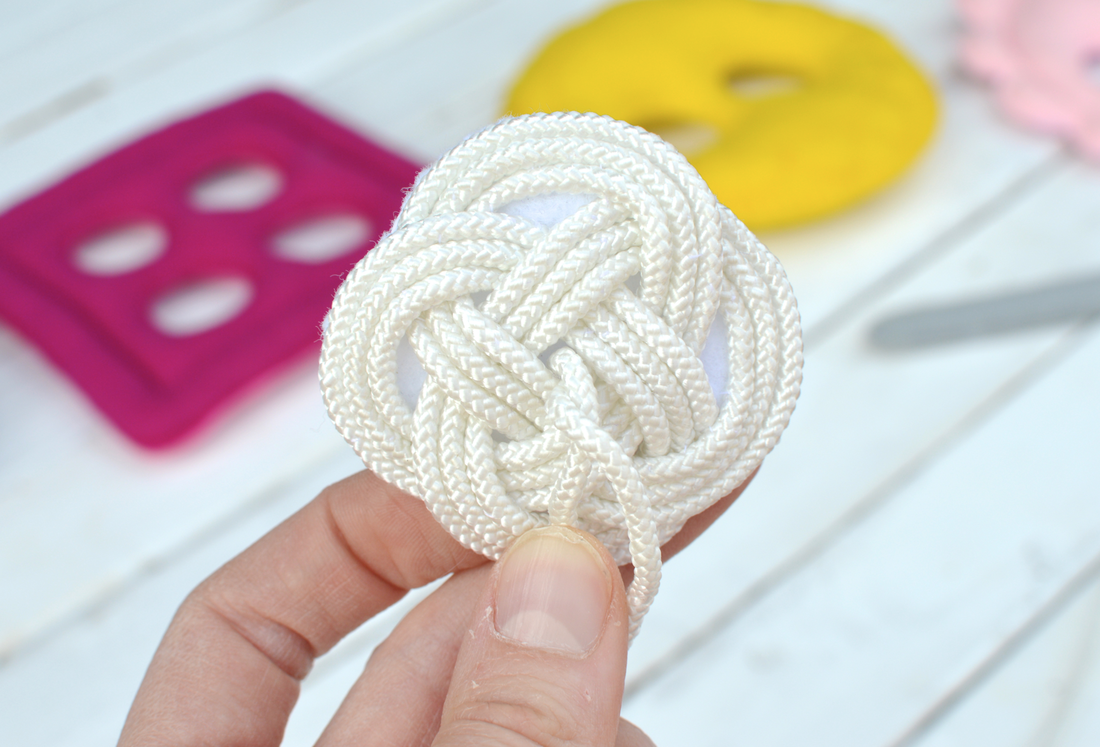 decorative knot for sewing toy needle and thread