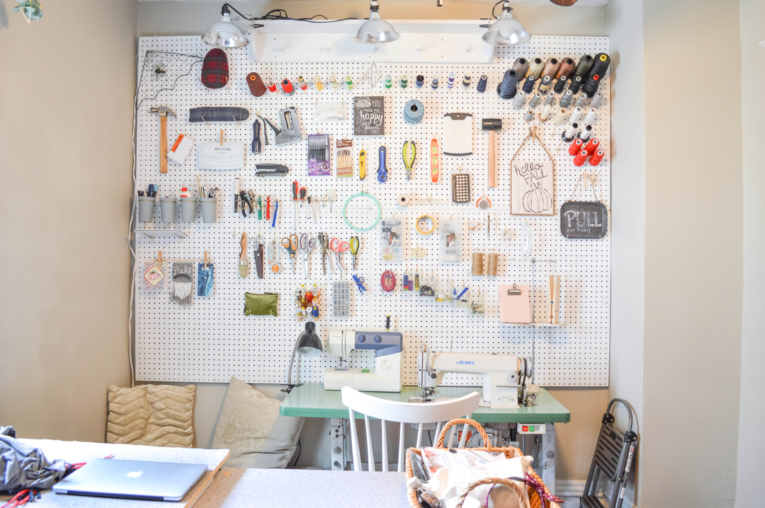 sewing studio makeover peg board wall